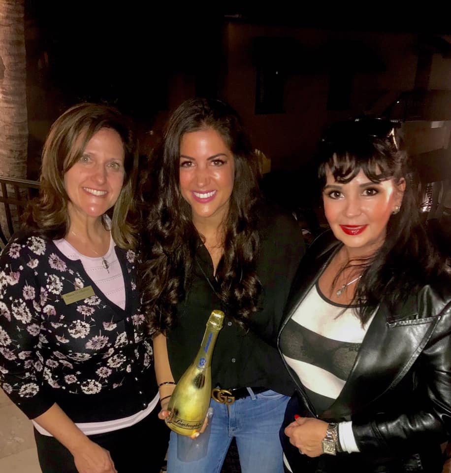 Shana Overhulser, Taryn and Gleny Zirio with Lamborghini Gold Champagne